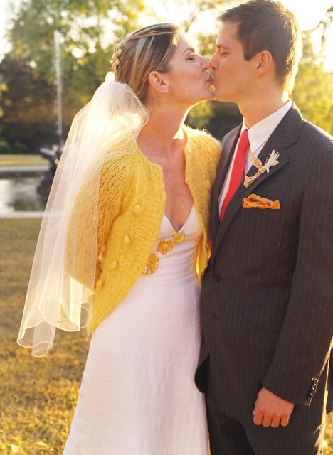 A sweet vintage yellow caridgan over a wedding dress 